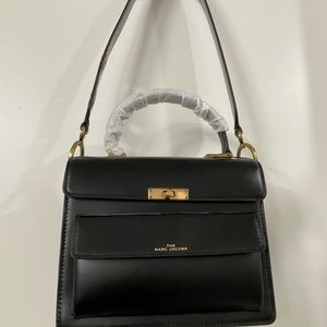 Marc Jacobs shoulder bag. NWT. Black leather. Red Canvas interior.